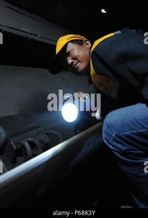 (180629) -- GOLMUD, June 29, 2018 (Xinhua) -- A maintenance worker checks the tracks at the Xinguanjiao Tunnel, the world's longest plateau rail tunnel, along the Qinghai-Tibet Railway in northwest China's Qinghai Province, June 27, 2018. With a length of 32.6 kilometers, the tunnel was put into operation at the end of 2014. (Xinhua/Hou Deqiang)(mcg) Stock Photo