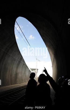 Golmud, Qinghai-Tibet Railway in northwest China's Qinghai Province. 27th June, 2018. Maintenance workers check equipment at the Xinguanjiao Tunnel, the world's longest plateau rail tunnel, along the Qinghai-Tibet Railway in northwest China's Qinghai Province, June 27, 2018. With a length of 32.6 kilometers, the tunnel was put into operation at the end of 2014. Credit: Hou Deqiang/Xinhua/Alamy Live News Stock Photo