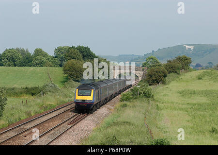 The main route from London to the West Country bypasses Bristol by traversing the Wiltshire Downs and passing under the gaze of the White Horse carved Stock Photo