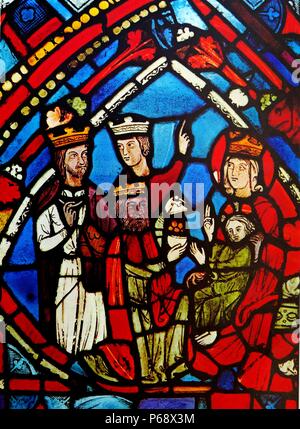 Stained glass window depicting the adoration of the Magi. Stock Photo