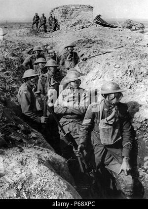 Australian infantry wearing gas masks with box respirators in a trench ...