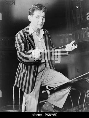 Photograph of Leonard Bernstein (1918-1990) American composer, conductor, author, music lecturer, and pianist. He was among the first conductors born and educated in the United States of America to receive worldwide acclaim. Dated 1955 Stock Photo