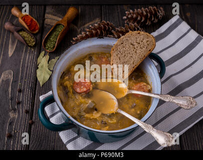 Slovak christmas cabbage soup with mushrooms on natural background. Stock Photo