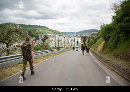 Participants march in the 49th Annual Marche Internationale de Diekirch, Diekirch, Luxembourg, May 21, 2016. This is an annual international marching event hosted by the Luxembourg Army and the city of Diekirch. Civilians and Military participants complete 80 kilometers during a two day period around the vicinity of Diekirch, Luxembourg. (U.S. Army photo by Spc. Tracy McKithern/Released) Stock Photo