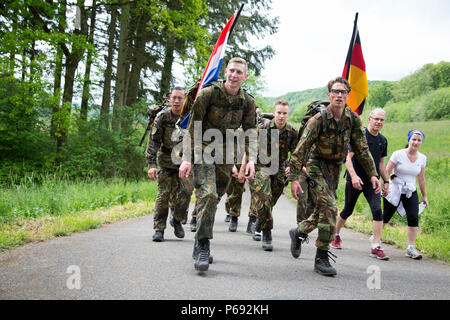 Participants march in the 49th Annual Marche Internationale de Diekirch, Diekirch, Luxembourg, May 21, 2016. This is an annual international marching event hosted by the Luxembourg Army and the city of Diekirch. Civilians and Military participants complete 80 kilometers during a two day period around the vicinity of Diekirch, Luxembourg. (U.S. Army photo by Spc. Tracy McKithern/Released) Stock Photo