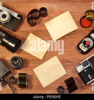 Topview of retro travel equipment on a wooden table. Vintage