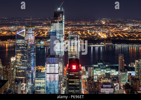 New York City, NY, USA - Mach 11, 2018: Night aerial view of Hudson Yards skyscrapers under contruction with the Hudson River. Chelsea, Manhattan Stock Photo