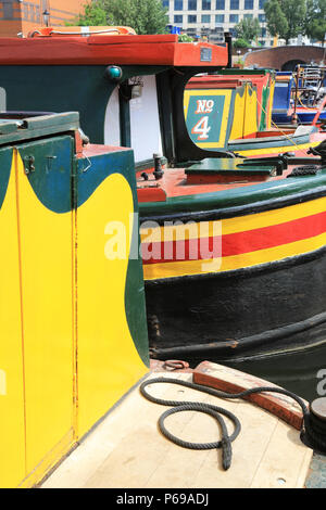 The colourful boats and barges in the attractive Gas Street Basin in Birmingham, in the West Midlands, in the UK Stock Photo
