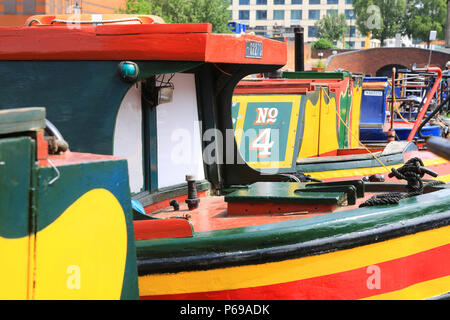The colourful boats and barges in the attractive Gas Street Basin in Birmingham, in the West Midlands, in the UK Stock Photo