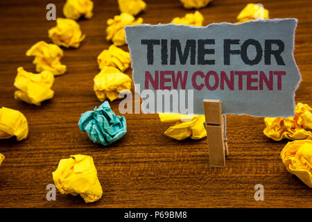 Writing note showing  Time For New Content. Business photo showcasing Copyright Publication Update Concept Publishing Cardboard with letters wooden fl Stock Photo