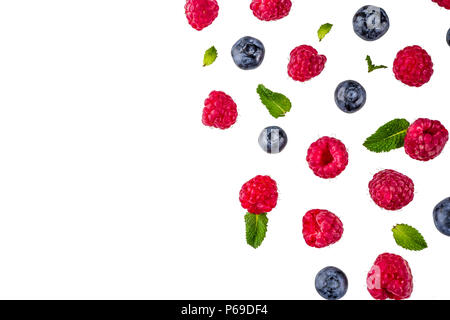 Creative layout with raspberry and blueberry with waffle ice cream cones, simple pattern above copy space Stock Photo