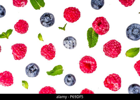 Creative layout with raspberry and blueberry with waffle ice cream cones, simple pattern above copy space Stock Photo