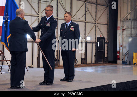 Col. Nathan B. Alholinna, new 114th Fighter Wing commander, recieves the Wing flag from Brig. Gen. Matthew P. Jamison during a Change of Command ceremony on May 1, 2016.  Alholinna takes the command from Brig. Gen. Russ A. Walz, new Director of Joint Staff and Chief of Staff for the South Dakota Air National Guard. (U.S. Air National Guard Photo by Staff Sgt. Duane Duimstra/Released) Stock Photo