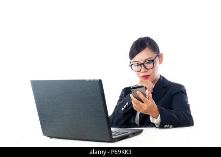 Business woman looking at the phone, analyzing the white background. Stock Photo