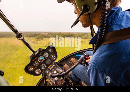 Jock at the control stick of his Robinson R44 Raven helicopter in Northern Territory, Australia