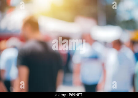 Blurry background for web site design, defocused people on city street Stock Photo