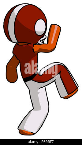 Orange football player man kick pose start. Stock Photo