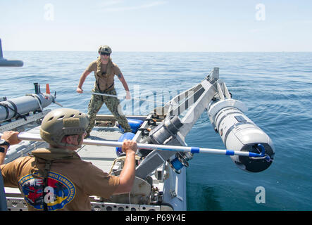 160514-N-SF508-072 PANAMA CITY, Fla. (May 14, 2016) — Engineman 2nd Class Jonathan Lavoie (left) and Aerographer’s Mate 1st Class Christopher Kyall (right), assigned to Mobile Diving and Salvage Unit 2 (MDSU) Unmanned Systems Platoon 204, prepare to deploy a Mark 18 Mod. 2 unmanned underwater vehicle during an Expeditionary Mine Countermeasure (ExMCM) certification exercise at Naval Support Activity Panama City, Fla.(U.S. Navy photo by Mass Communication Specialist 2nd Class Charles Oki/Released) Stock Photo