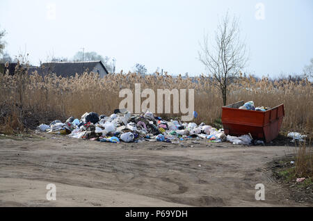 The garbage can is packed with garbage and waste. Untimely removal of garbage in populated areas . Stock Photo