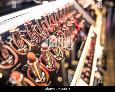 Lipsticks on a shelf at a Champs-Élysées makeup shop in Paris, France. Stock Photo