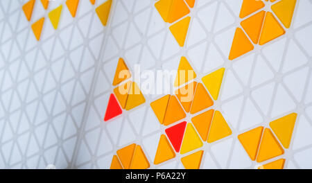 Puzzle made of colored glass with triangular shapes Stock Photo