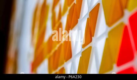 Puzzle made of colored glass with triangular shapes Stock Photo