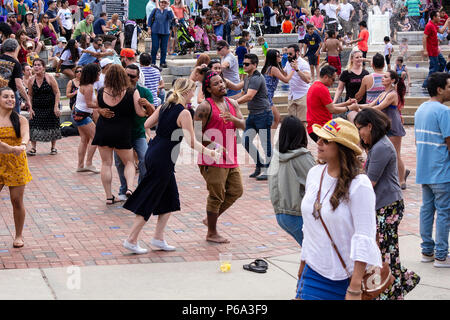 Many couples dance at the Hola Asheville Festival, celebrating Latin American culture, in Asheville, NC, USA Stock Photo