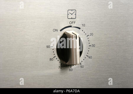 close up shot of oven time button Stock Photo