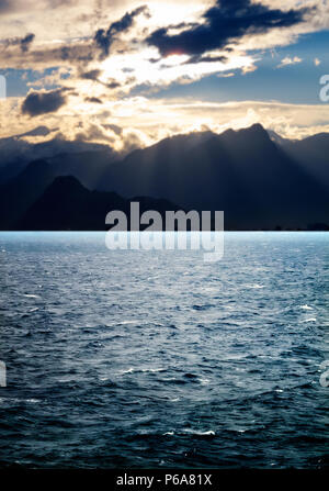 seascape image of windy weather and waves on sea over cloudy sky during sunset in antalya Stock Photo