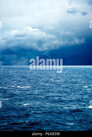 seascape image of windy weather and waves on sea over cloudy sky Stock Photo