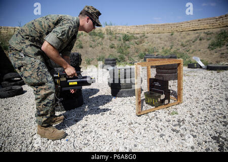 Sgt. Alex Micciche, an explosive ordnance disposal technician, prepares to use an energetic tool during a counter-improvised explosive device range near Naval Air Station Sigonella, Italy, May 24, 2016.  EOD Marines with Special Purpose Marine Air-Ground Task Force Crisis Response-Africa used precision energetic tools to safely render an IED useless.  (U.S. Marine Corps photo by Cpl. Alexander Mitchell/released) Stock Photo