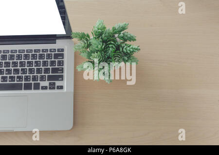 laptop blank screen on wooden table Stock Photo