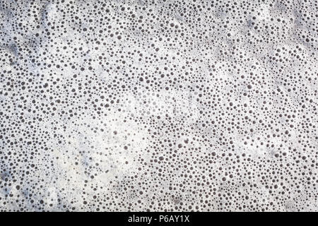 Background texture of many small foam bubbles at water surface Stock Photo