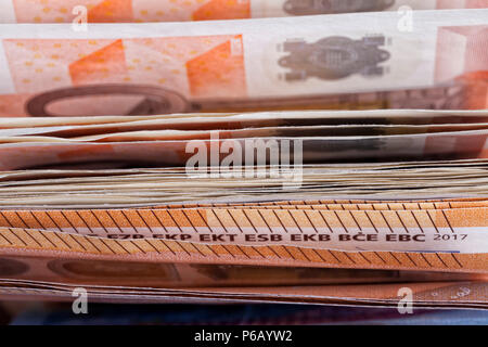 Many euro bills used and poorly stacked. Stock Photo