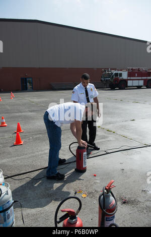 U.S. Army Garrison Fire Department members check their SCBA (Self ...