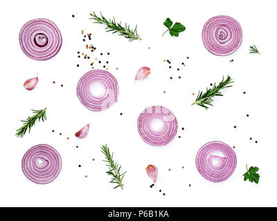 Sliced red onions set with spices and herbs isolated on white background.Top view Stock Photo
