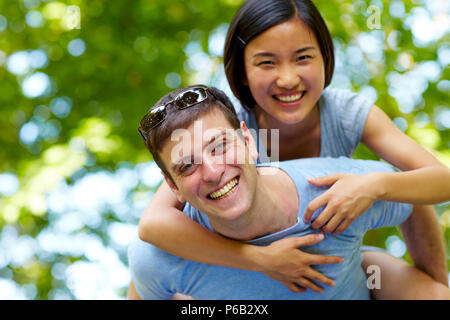 young asian girl with young european man together Stock Photo