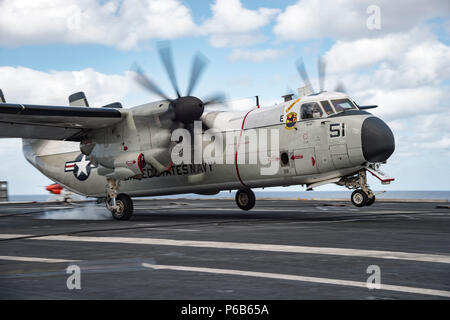 A C2-A Greyhound makes an last arrested landing aboard the USS Dwight D ...