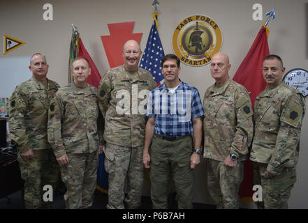 CAMP ARIFJAN, Kuwait – Secretary of the Army Dr. Mark Esper stopped for a photo with the 28th Infantry Division command group during his visit to Camp Arifjan, on June 21, 2018. The soldiers are, from left to right: Col. Jeffrey Heasley, chief of staff; Brig. Gen. Stephen Radulski, deputy commanding general – operations; Maj. Gen. Andrew Schafer, commanding general; Command Sgt. Maj. John Jones and Brig. Gen. Mark McCormack deputy commanding general – support. (U.S. Army photo by Lt. Col. Keith Hickox) Stock Photo