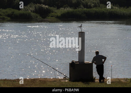 Man Fly Fishing, Sitting on Collapsible Chair Stock Photo - Image