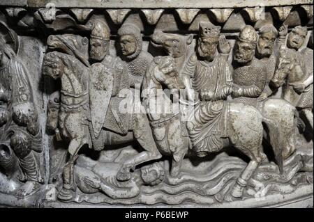 Italy. Lucca. Basilica of San Frediano. Baptismal font. Romanesque. 12th century. Reliefs depicting life of Moses. By Master Roberto. Detail of Soldiers Crossing the Red Sea. Stock Photo