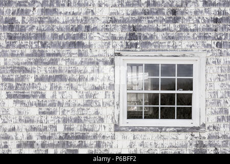 Old window, old wall and old shingles with peeling paint. Space for text. Stock Photo