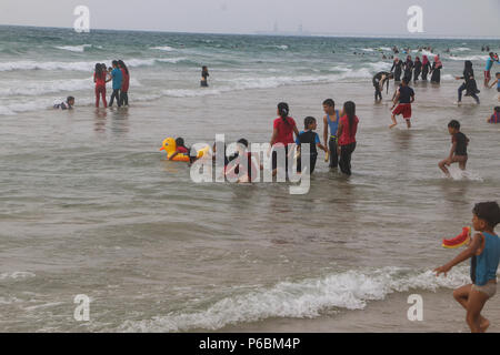 The seashore of the Gaza Sea is crowded with holidaymakers and is the only place where Gazans feel free. Stock Photo