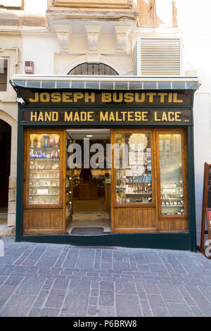 Exterior shopfront / storefront of the Joseph Busuttil Handmade Maltese Lace and souvenir shop / store in Valletta, Malta. (91) Stock Photo