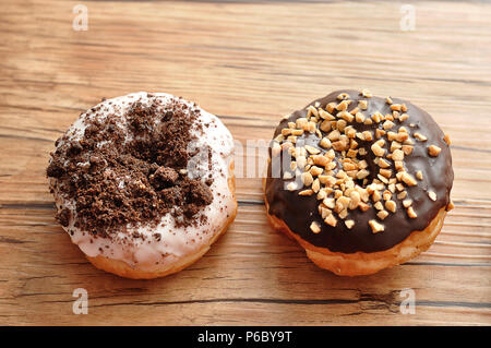 Delicious doughnuts covered in various toppings Stock Photo