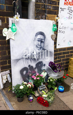 The first anniversary of the 24-storey Grenfell Tower block of public housing flats fire which claimed 72 lives. Shrine with painting of a young male victim, South Kensington, London, UK, 14th June 2018. Stock Photo