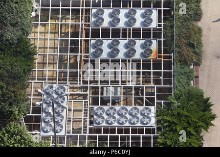 Exhaust vents of industrial air conditioning and ventilation units. Supermarket roof top. Stock Photo