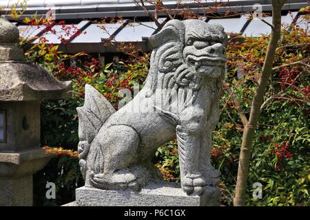 Komainu statue in Kyoto, Japan. The lion-dog statues are often