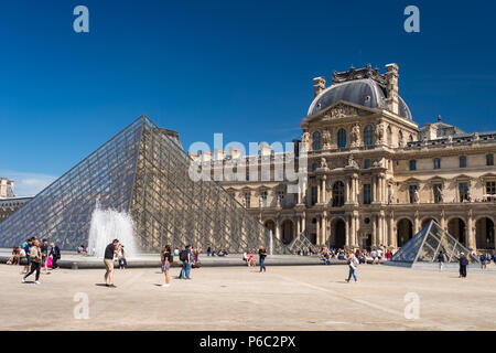 Paris, France - 23 June 2018: Louvre museum and Louvre Pyramid in summertime Stock Photo