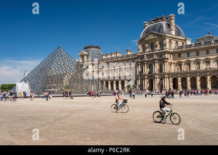 Paris, France - 23 June 2018: Louvre museum and Louvre Pyramid in summertime Stock Photo